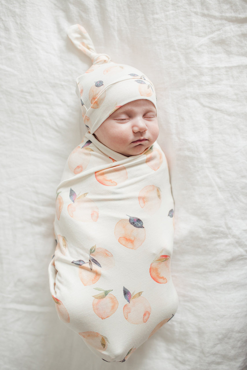 Copper Pearl Large Premium Knit Swaddle Caroline gift-ready packaging, signaling ready-to-gift appeal.
