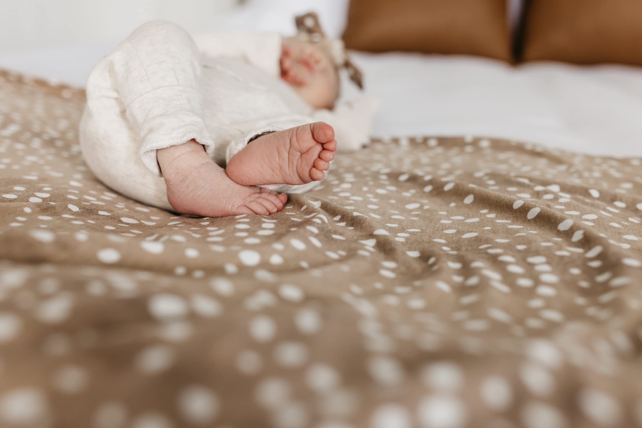 Copper Pearl swaddle fawn soft-texture close-up emphasizes durability and gentle stretch.