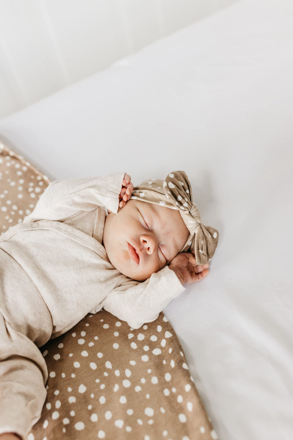 Copper Pearl large knit swaddle fawn illustrates versatile use as cover or blanket.