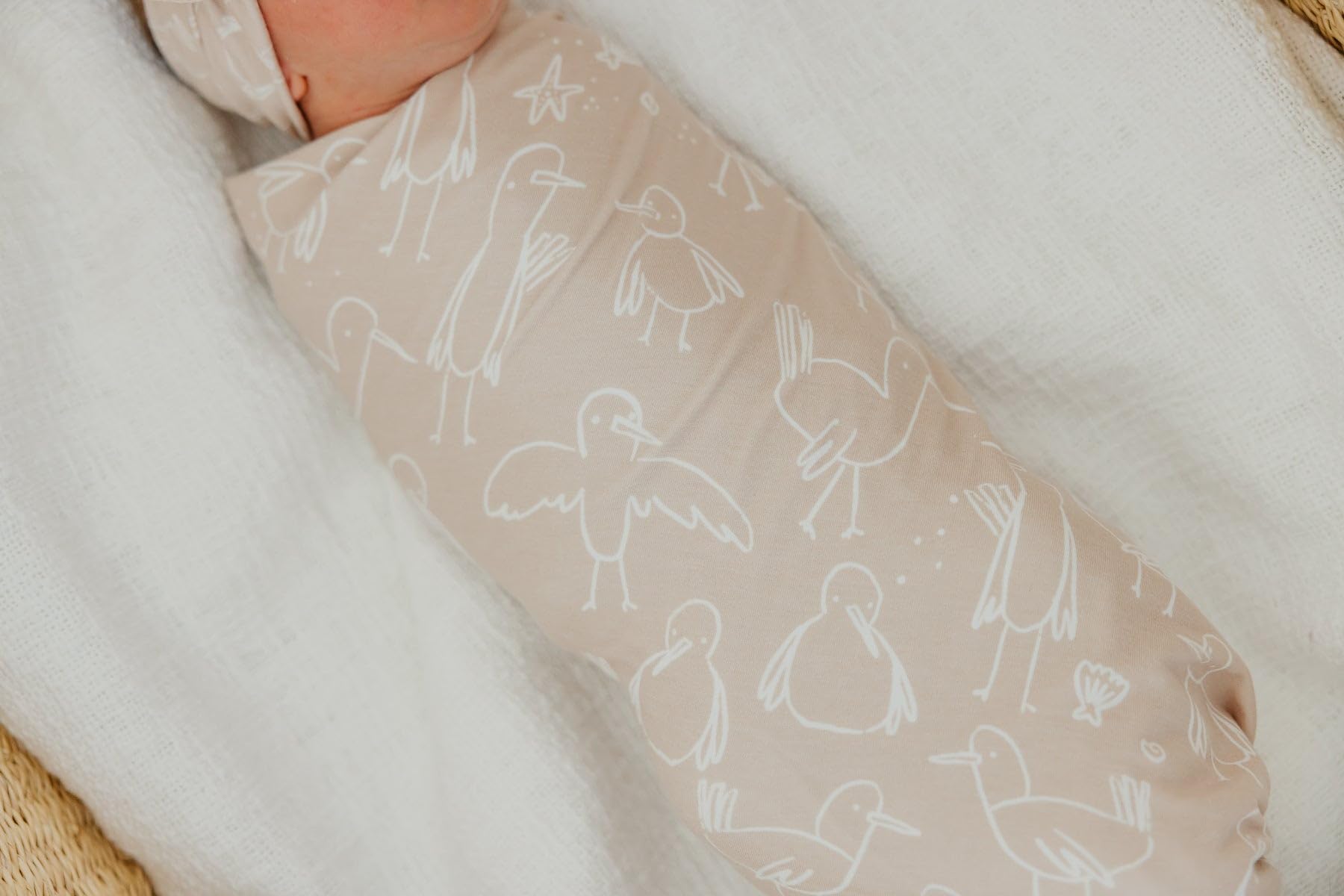 Copper Pearl swaddle sandy breathable-fabric keeps baby comfortable and cool during naps.