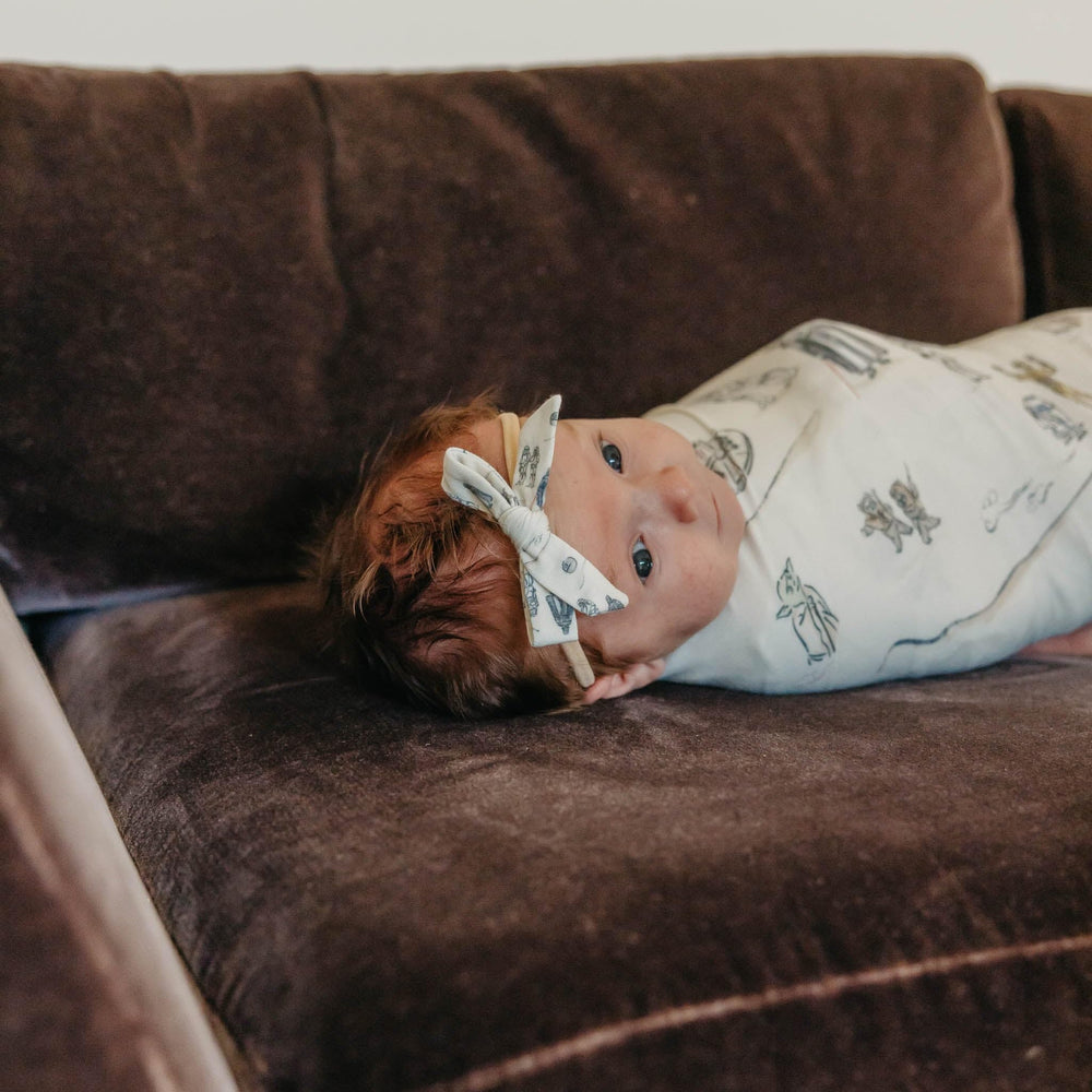 Copper Pearl large swaddle Tatooine 46x46 coverage supports growing babies.