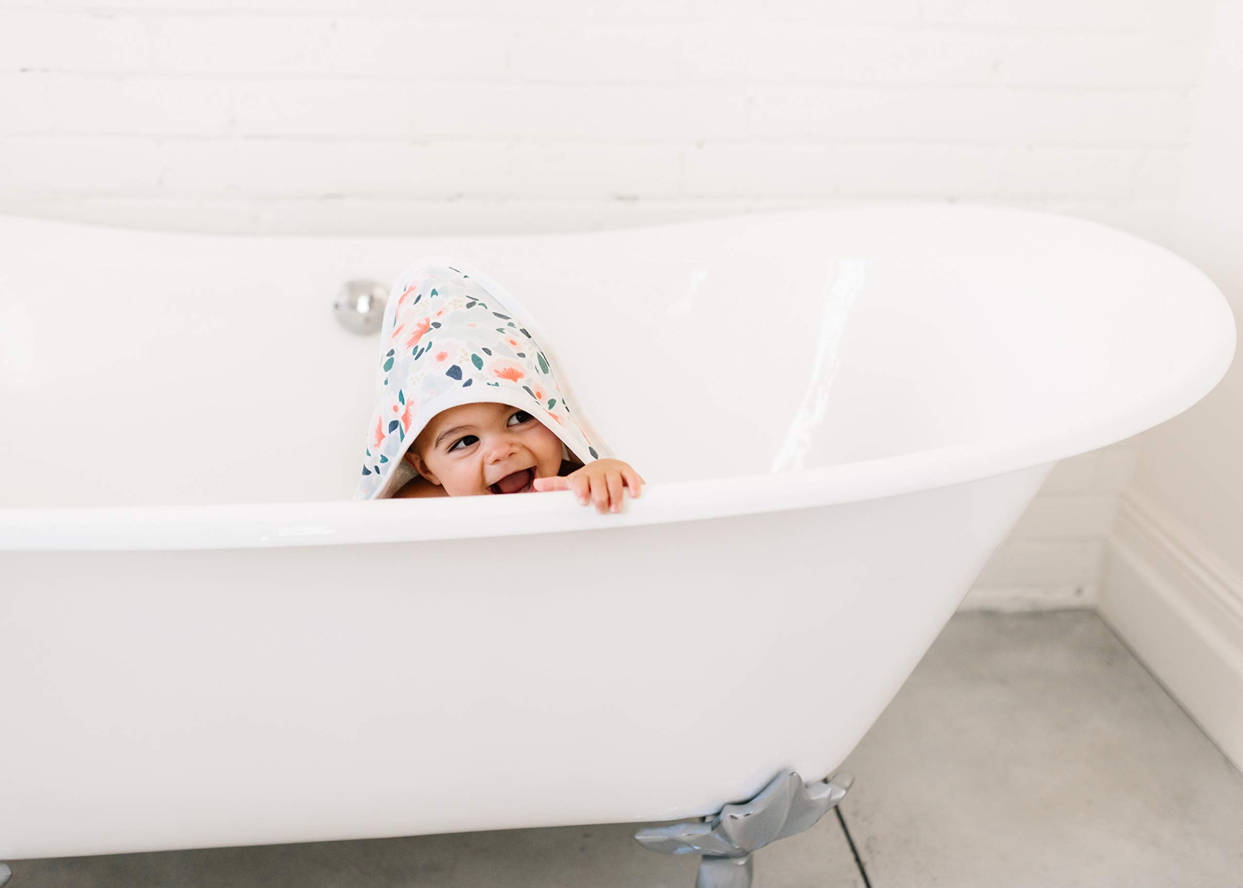 Copper Pearl Leilani hooded towel with tiny pockets to keep little hands warm.