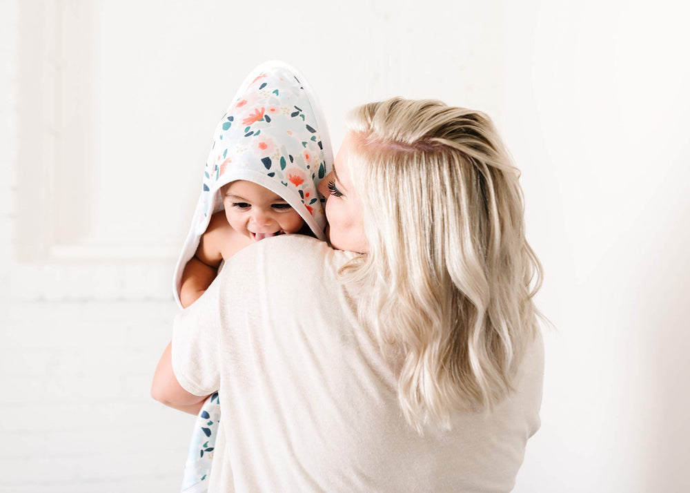 Copper Pearl Leilani hooded towel size 33x33 inches offers room from infancy through toddler years.