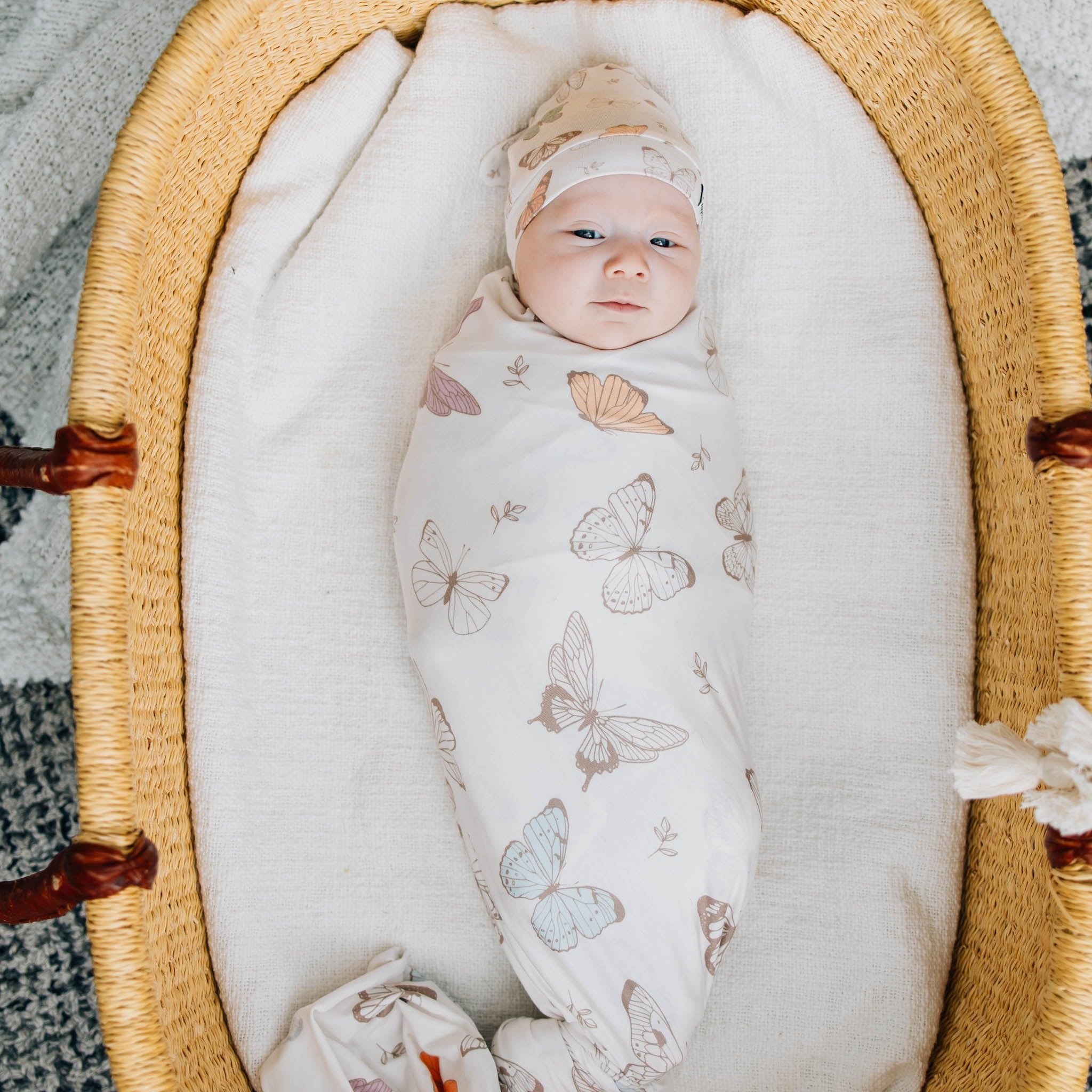 Copper Pearl Luna knit blanket used as a cozy playmat during tummy time