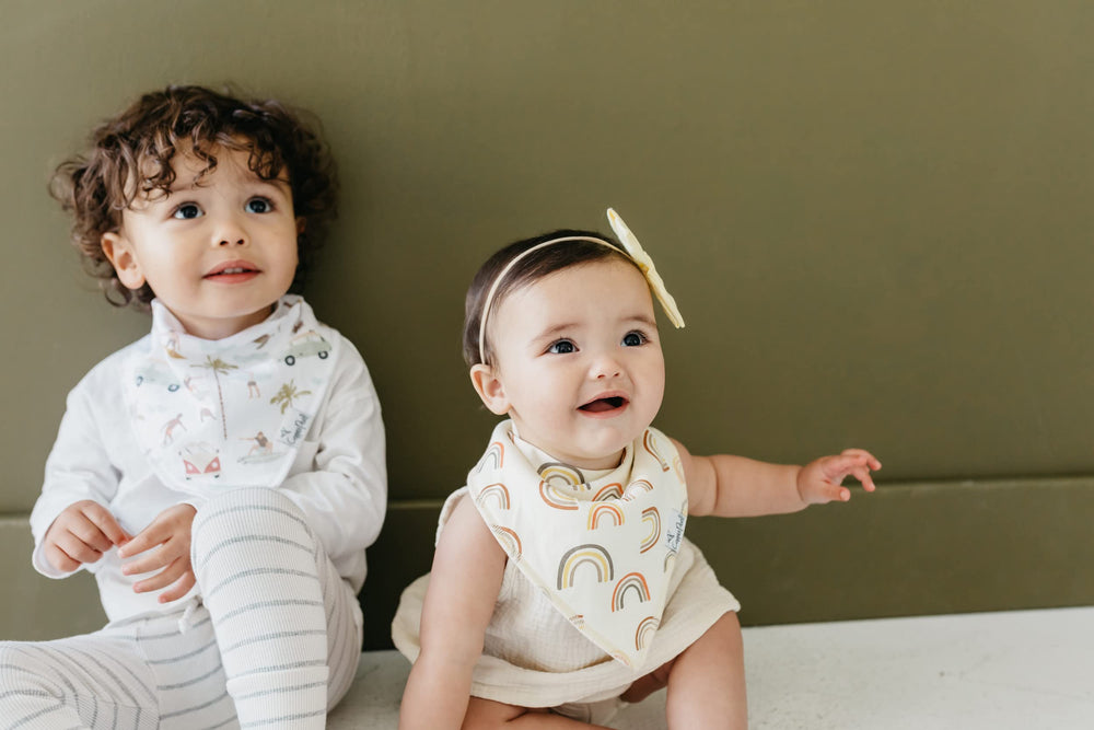 Copper Pearl Maui bandana bib worn on baby with secure nickel-free snaps for a comfy fit.