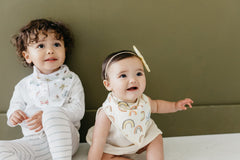 Copper Pearl Maui bandana bib worn on baby with secure nickel-free snaps for a comfy fit.