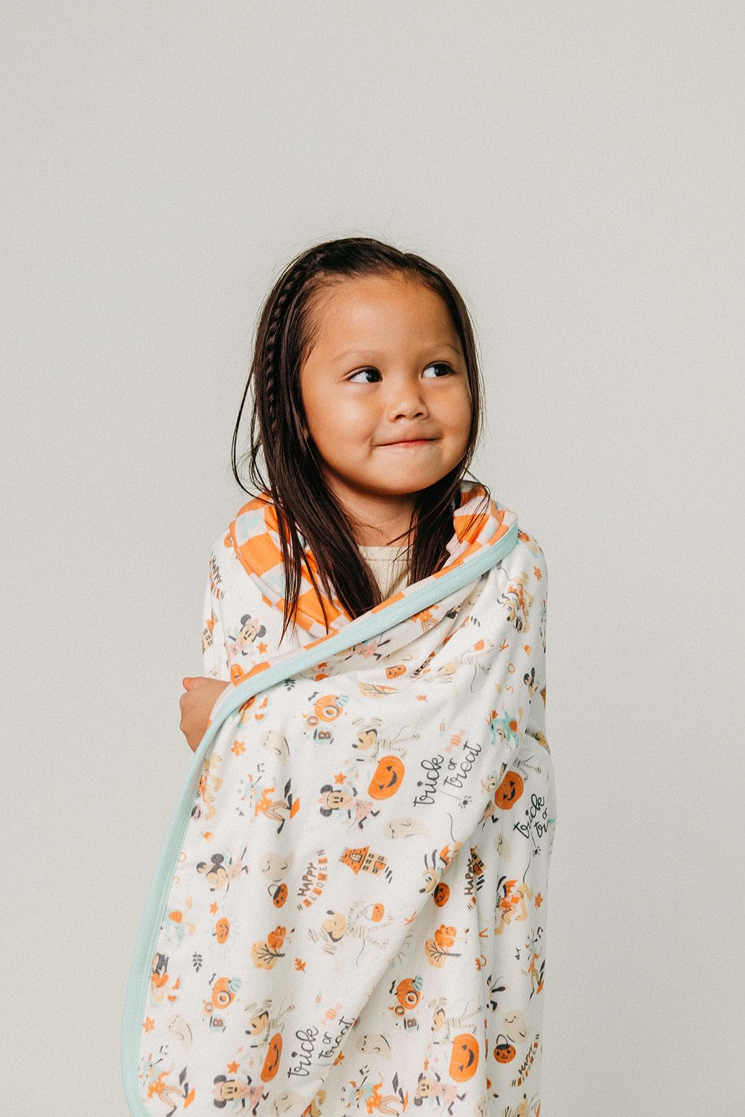 Copper Pearl Mickey Boo Bash blanket in use during playtime and tummy time