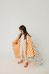 Copper Pearl blanket closeup with Mickey Boo Bash design for nursery style