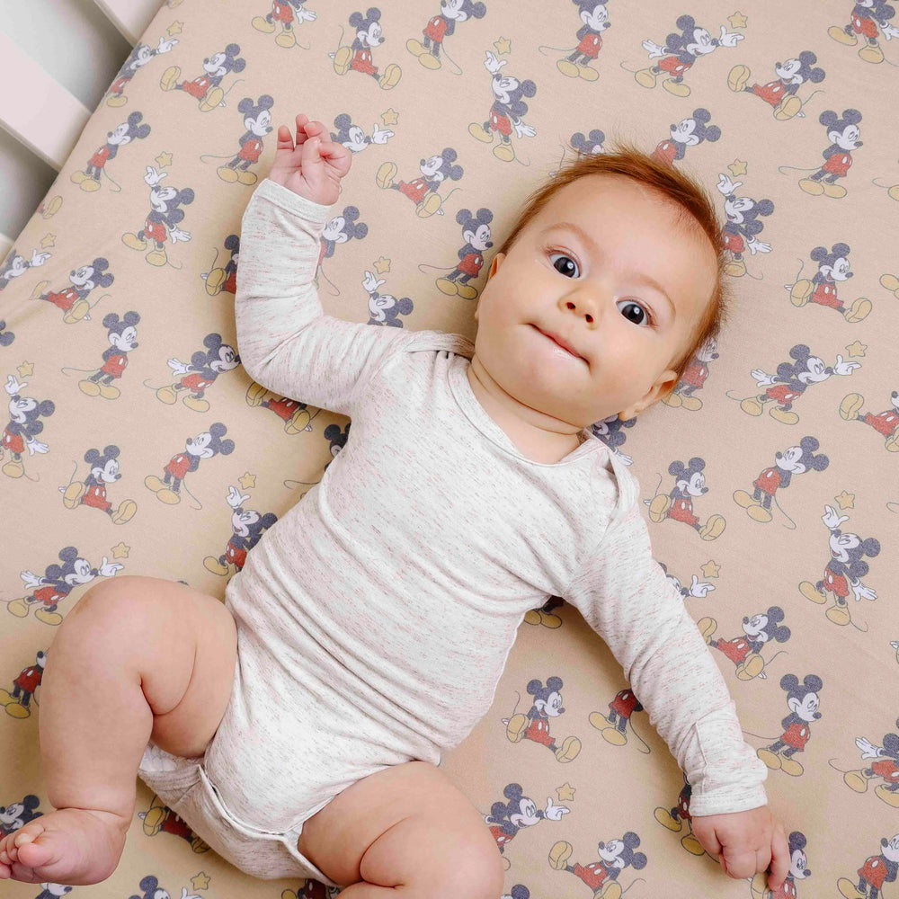 Copper Pearl Mickey Mouse crib sheet with full-elastic edge provides a snug, secure fit.
