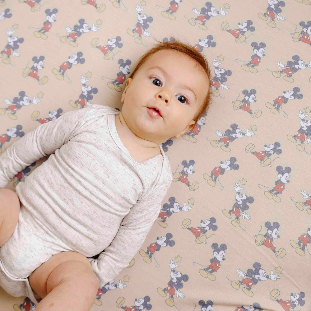 Copper Pearl Mickey Mouse crib sheet coordinates with other Copper Pearl products.