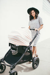 Copper Pearl shopping cart cover keeps baby comfy and clean during errands