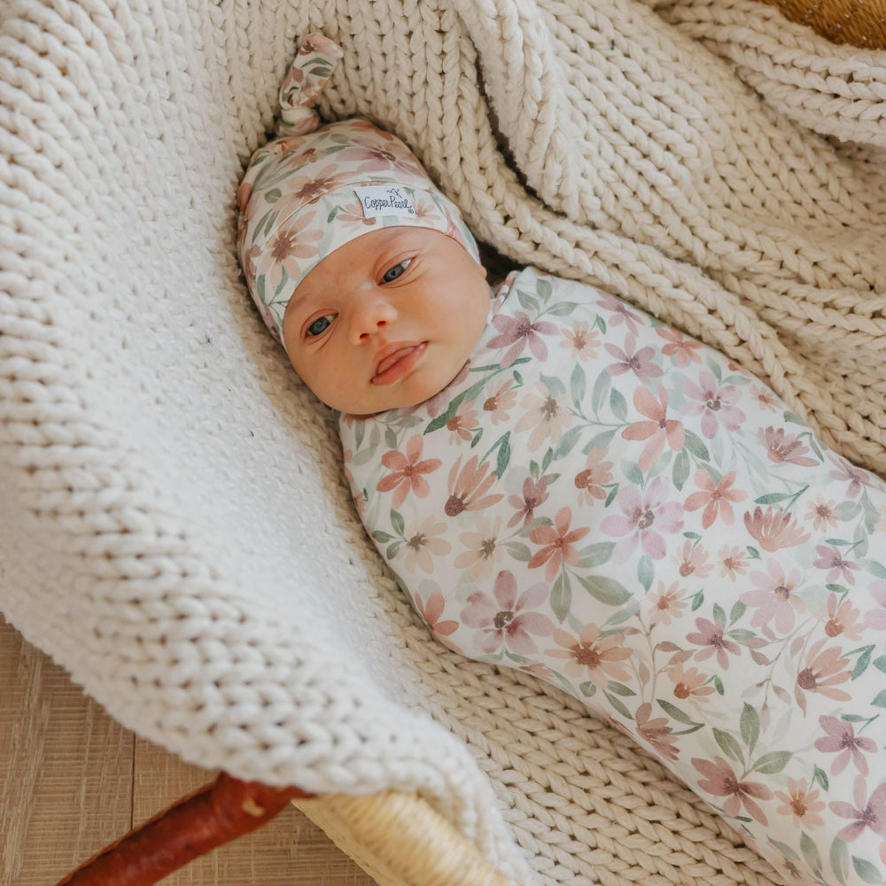 Copper Pearl Natalie Knit Blanket Single draped as a soft baby wrap for warmth