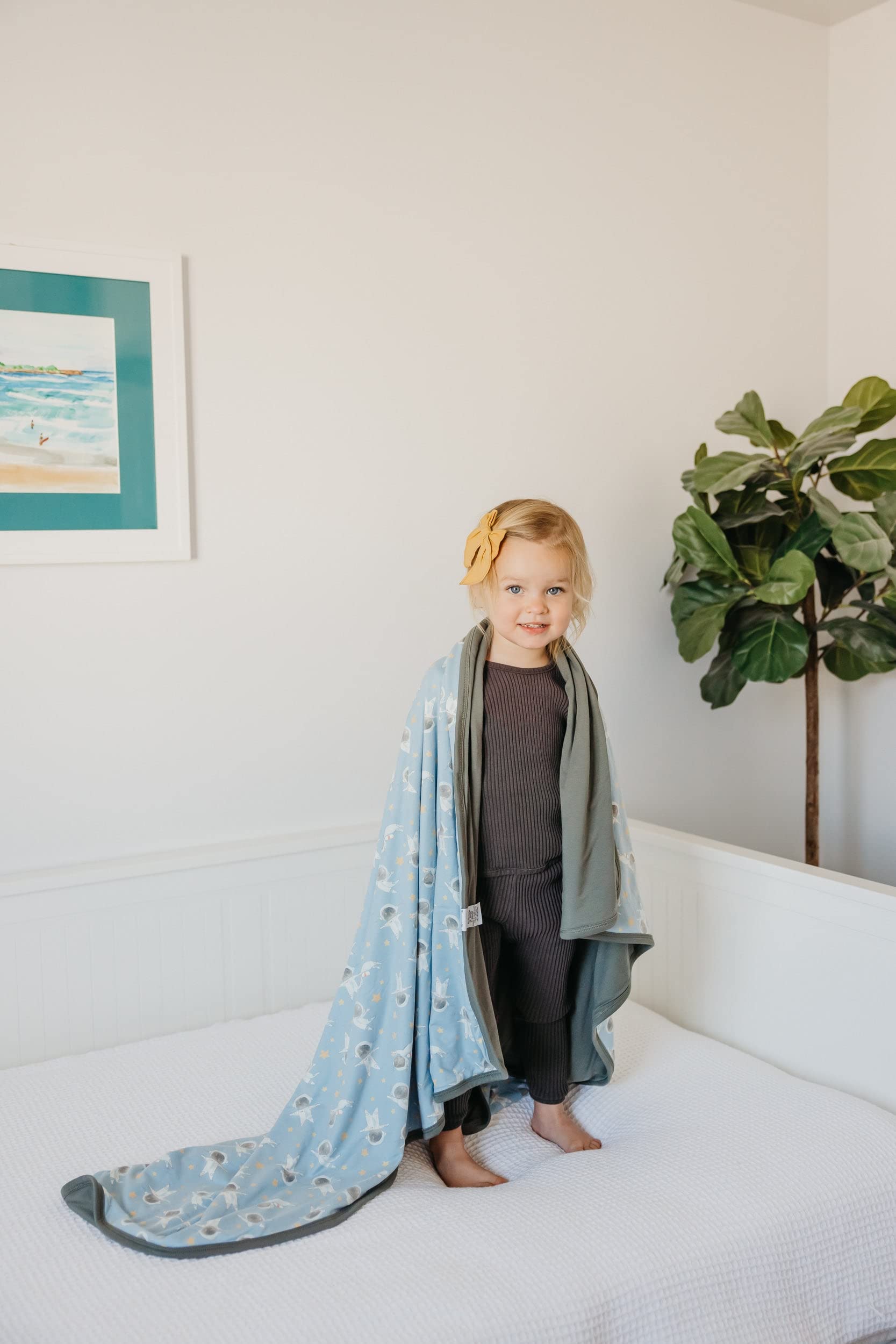Copper Pearl Neil three-layer blanket with newborn snuggle use during naps.