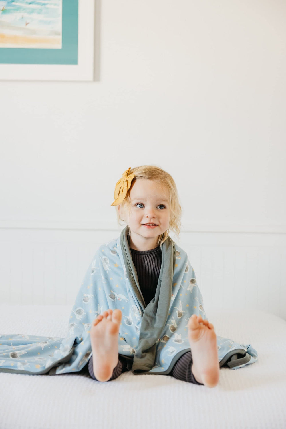 Copper Pearl Neil three-layer blanket design showcased in nursery setting.