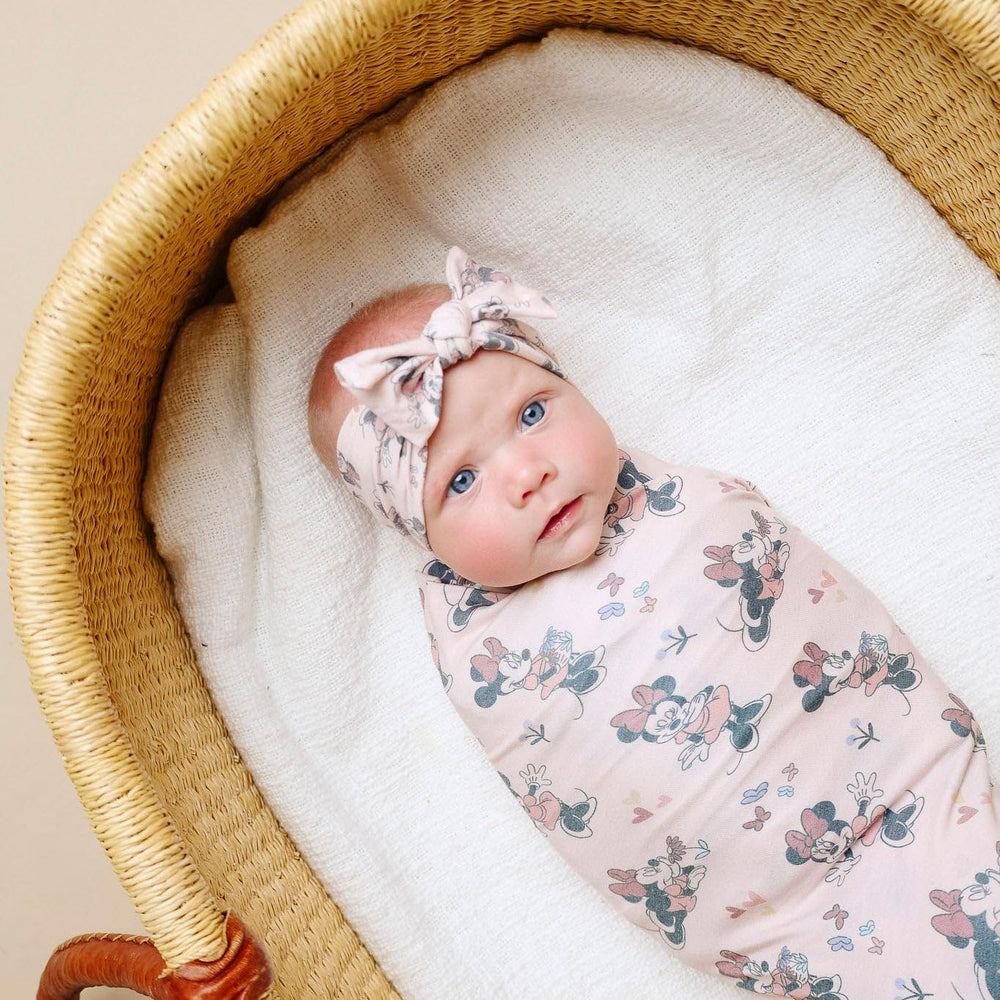 Copper Pearl newborn-sized bow headband balancing comfort and cuteness as baby grows.