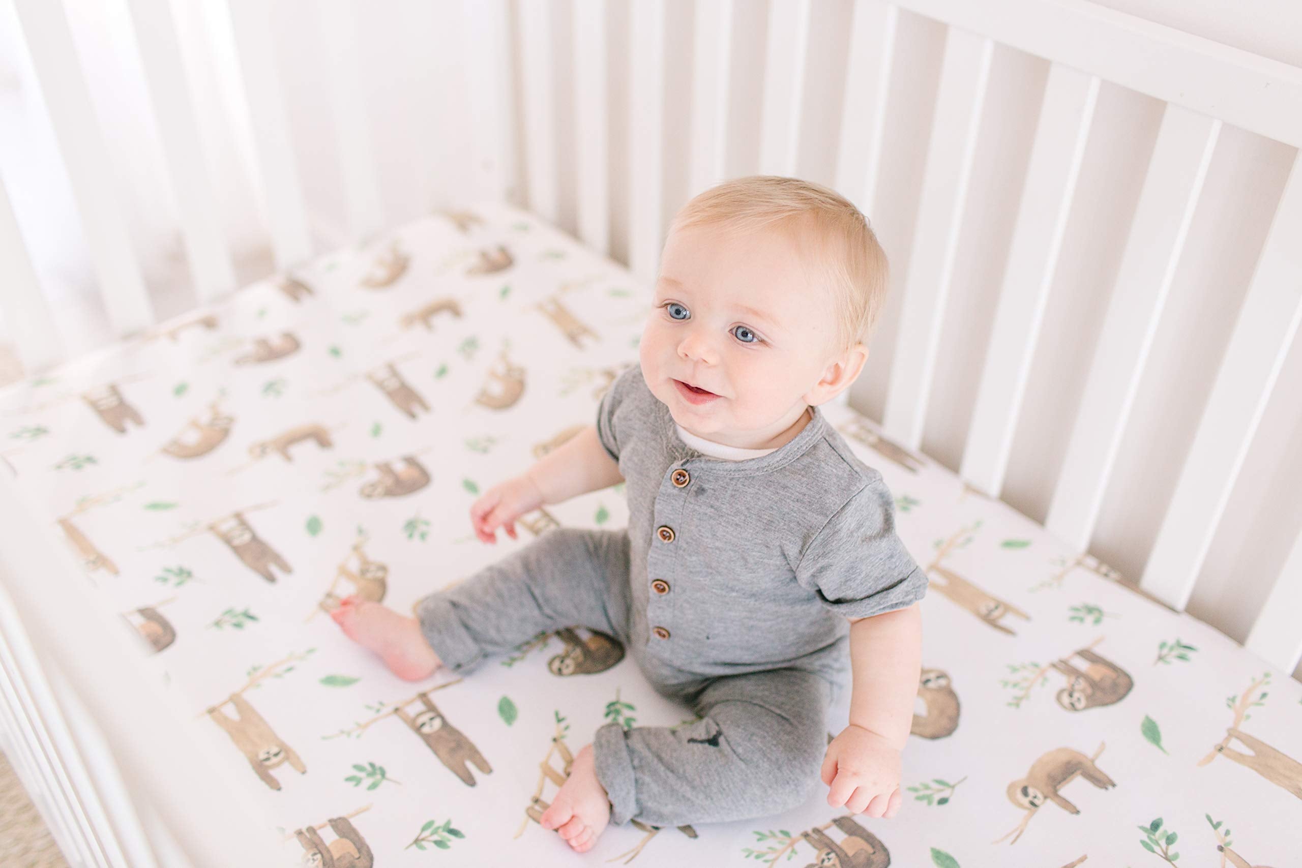 Copper Pearl Noah baby sleeping on premium knit crib sheet