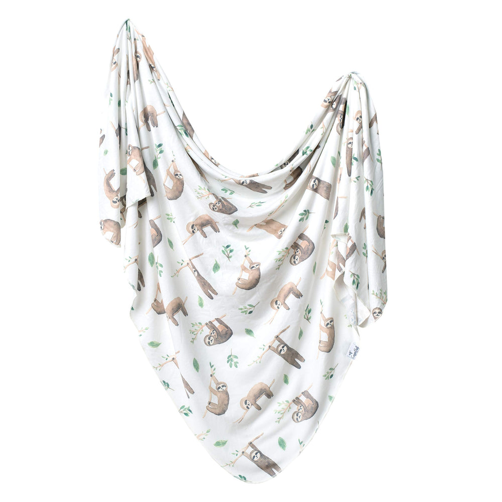 Copper Pearl Noah swaddle blanket fold shows soft premium knit fabric for easy swaddling.