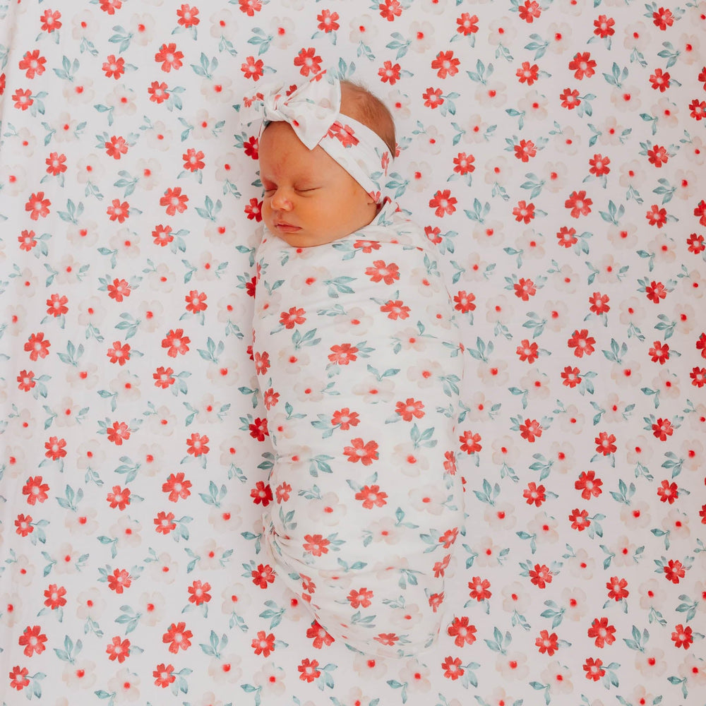 Copper Pearl Noel Knit Headband newborn-fit suits newborns and grows with baby.