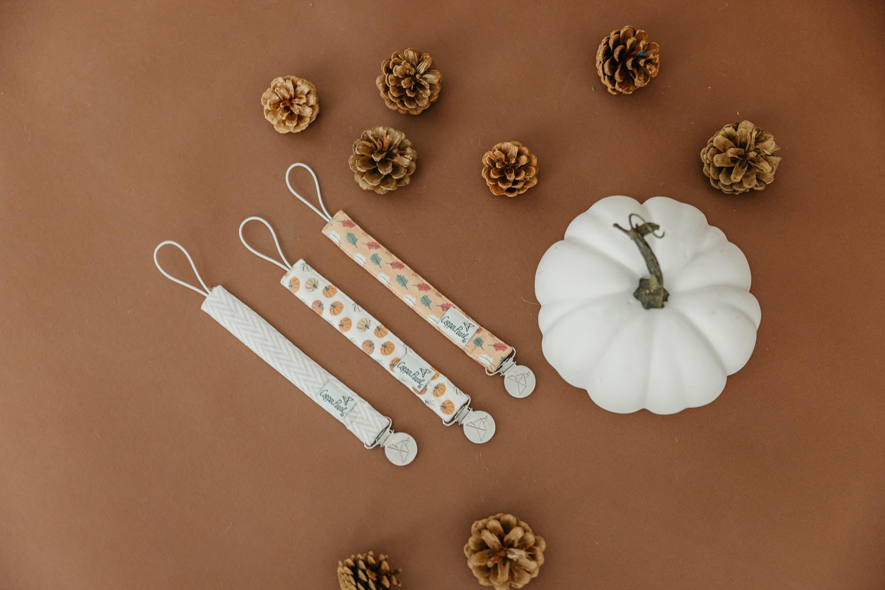 Copper Pearl pacifier clip absorbent fleece lining demonstrates drool protection and comfort