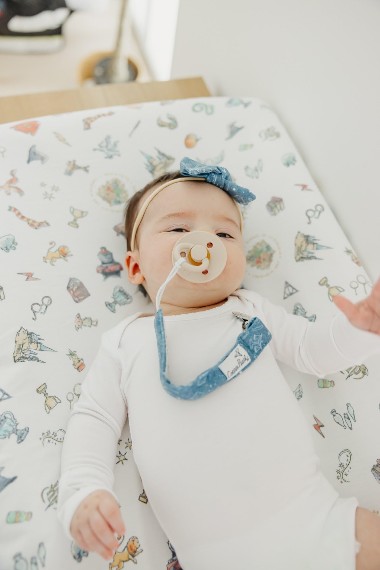 Copper Pearl pacifier clip premium knit strap pairs with any outfit for stylish baby gear.