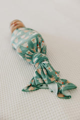 Copper Pearl Prancer swaddle blanket stroller shield used outdoors to block wind