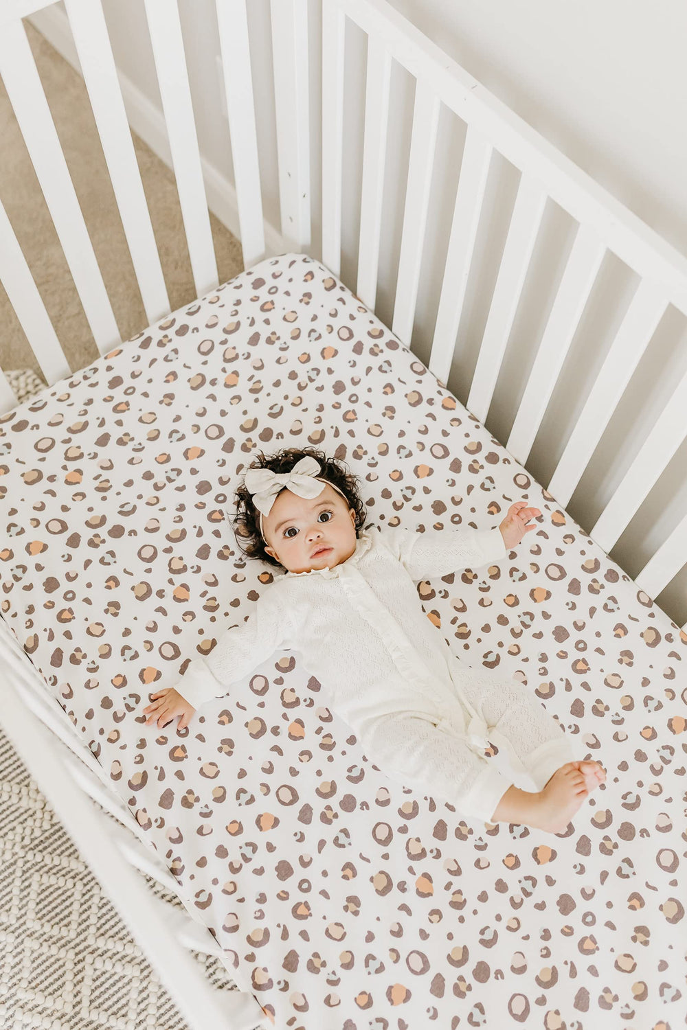 Copper Pearl premium gift packaging crib sheets for baby showers.