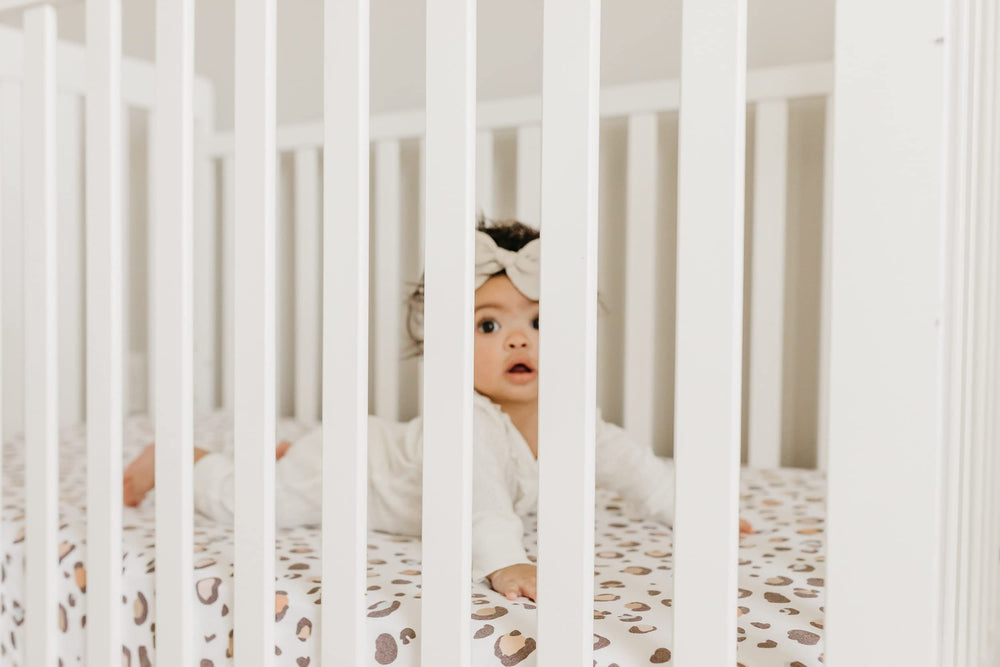 Copper Pearl premium knit crib sheet with elastic stitching for a tight, secure fit.