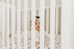 Copper Pearl premium knit crib sheet with elastic stitching for a tight, secure fit.
