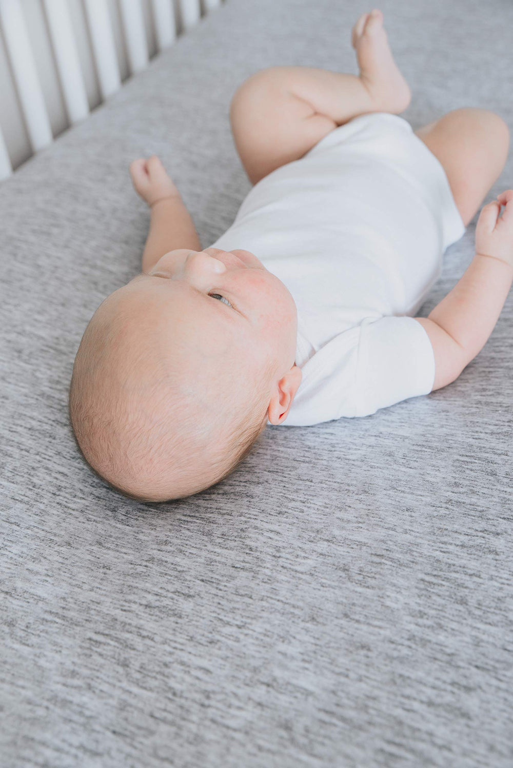 Copper Pearl premium knit crib sheets Asher gift packaging illustrates a ready-to-gift present for baby showers.