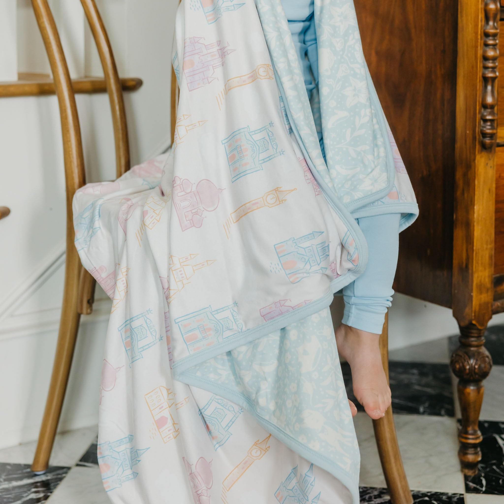 Copper Pearl Princess Palaces baby swaddle in bed; breathable warmth for cozy naps