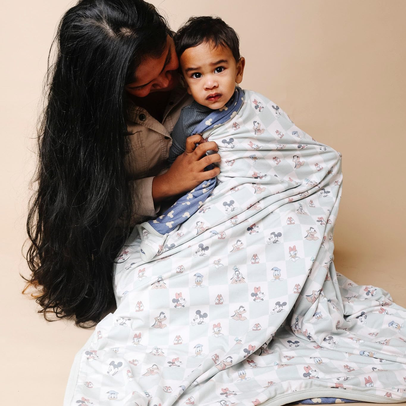 Copper Pearl quilt's soft breathable fabric highlights versatility as swaddle or receiving blanket.