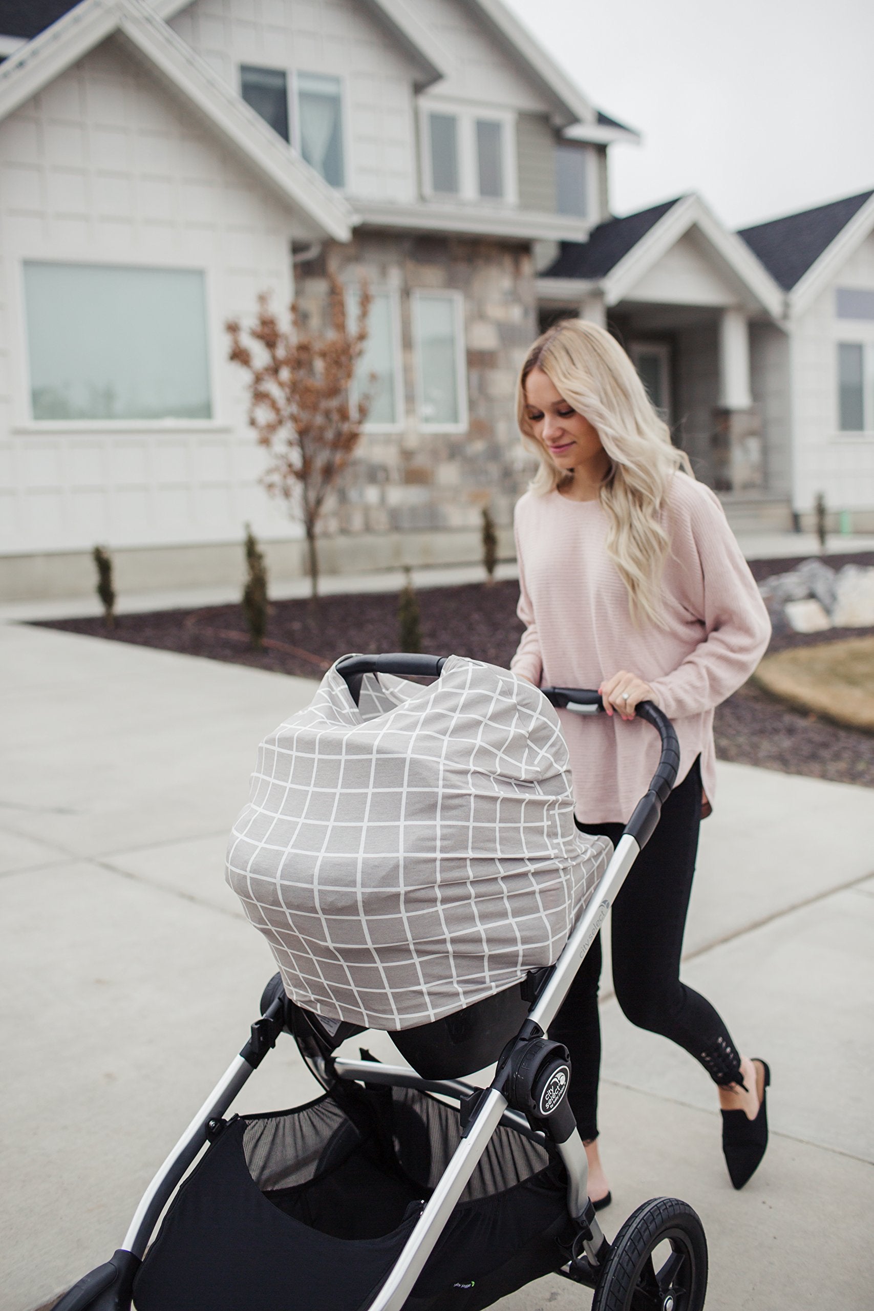 Copper Pearl shopping-cart-cover protects baby during errands while easy to clean.