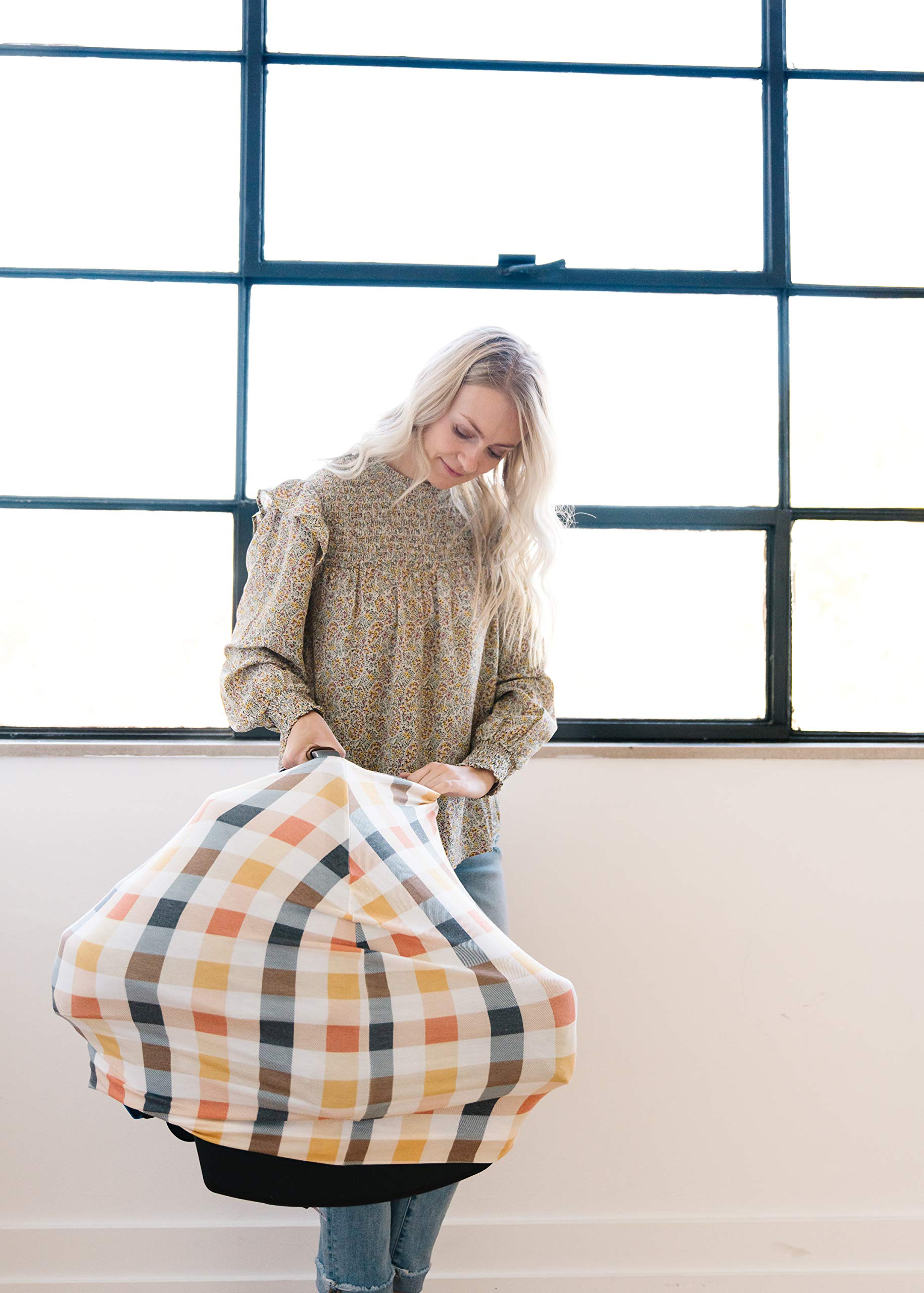 Copper Pearl shopping cart cover shields baby from surfaces while shopping.