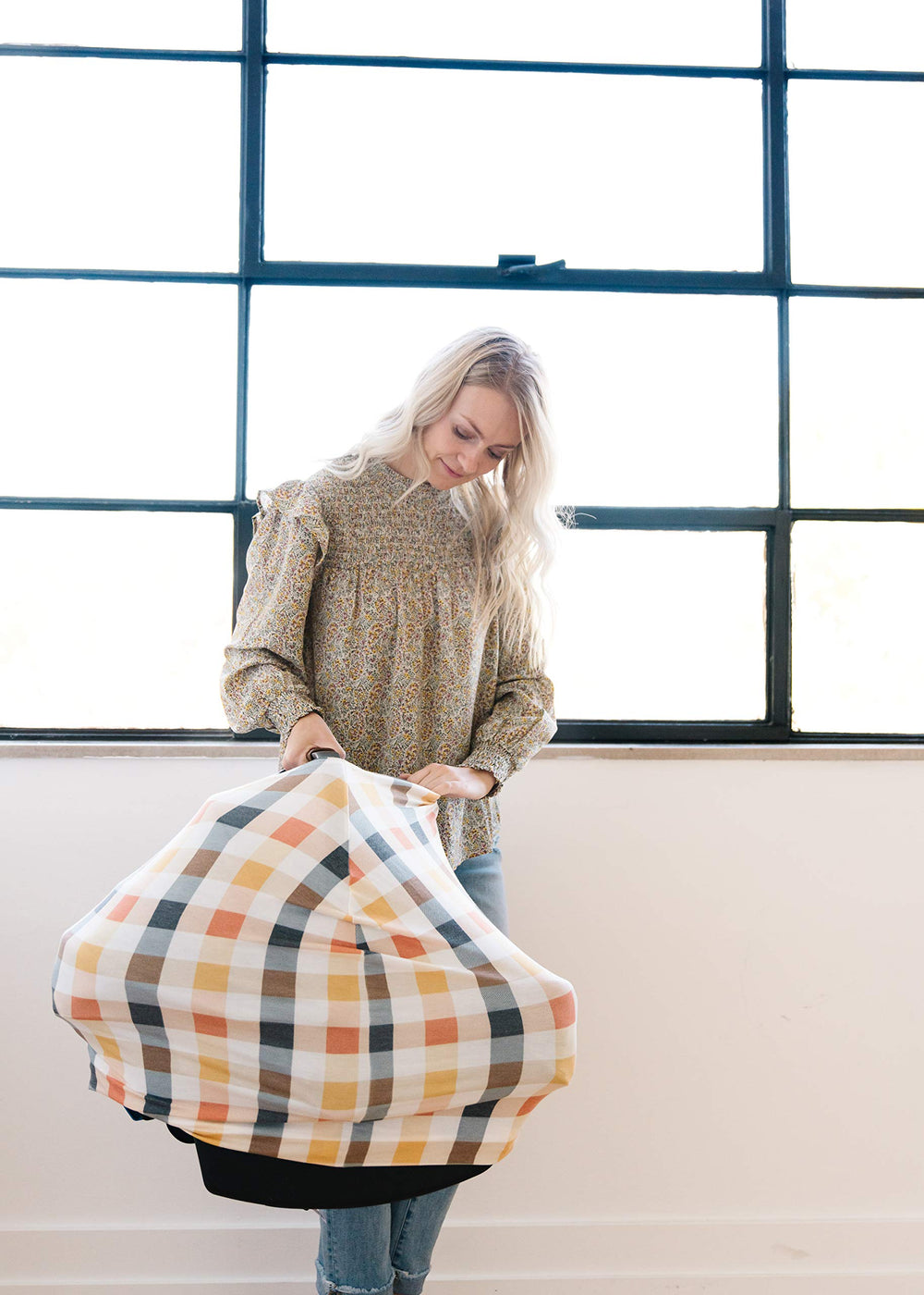 Copper Pearl shopping cart cover shields baby from surfaces while shopping.