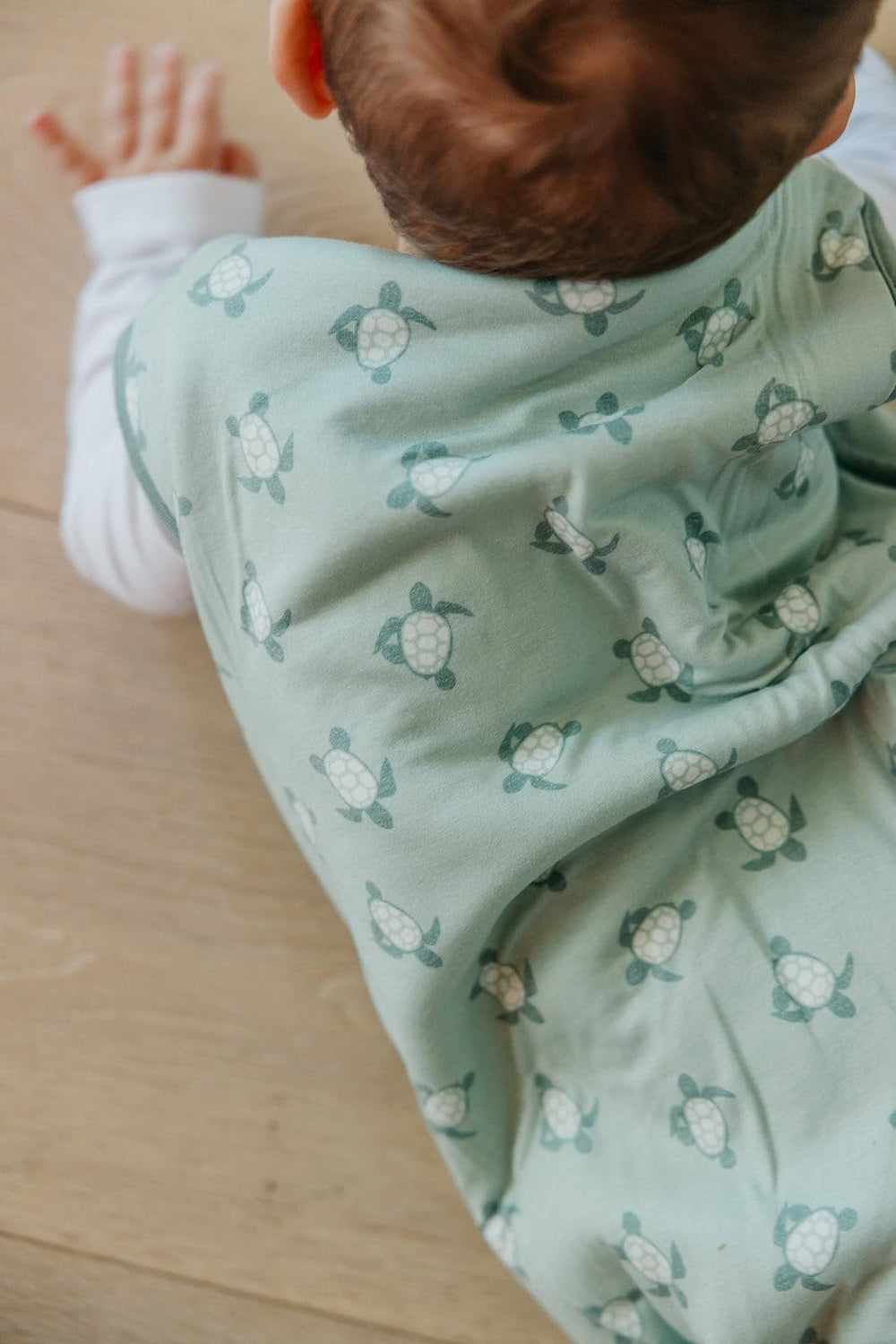 Copper Pearl Sleep Sack Wade size range shows fit from newborn to 24 months