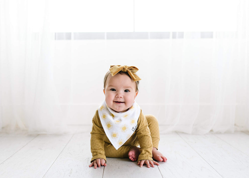 Copper Pearl Sunny Set bibs in daily use during teething and drool moments