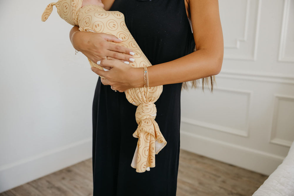 Copper Pearl swaddle blanket gift-ready packaging suits baby showers.