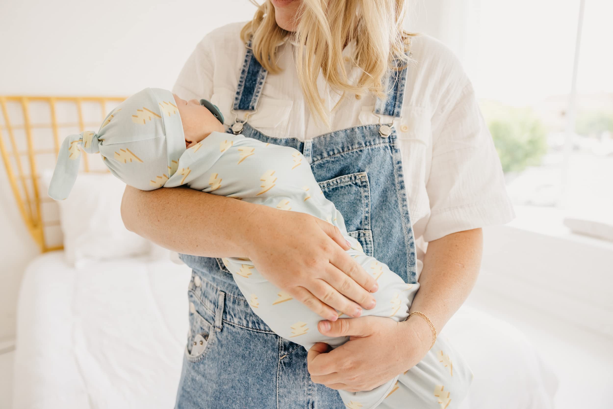 Copper Pearl swaddle blanket machine-washable image emphasizes easy care.