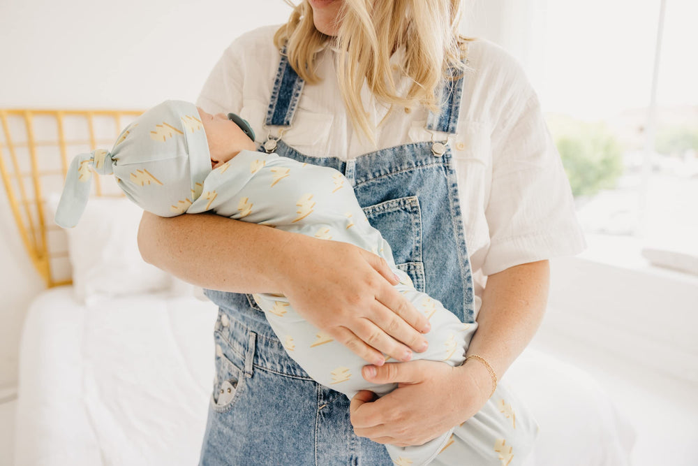 Copper Pearl swaddle blanket machine-washable image emphasizes easy care.