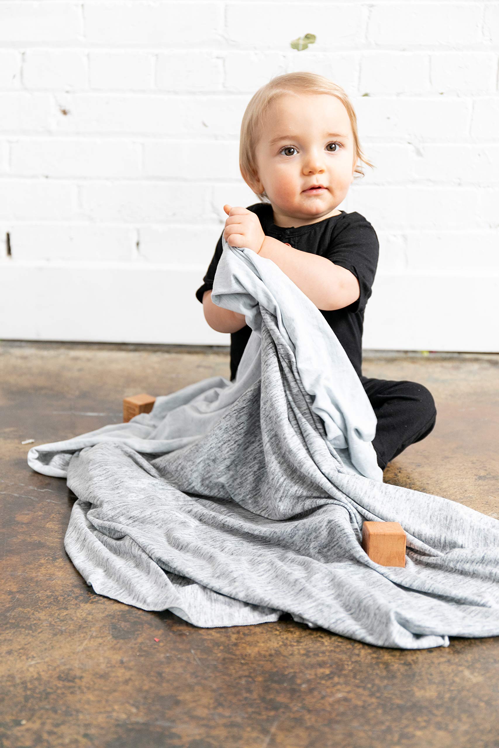 Copper Pearl swaddle blanket machine-washable tag emphasizes easy care for busy parents.