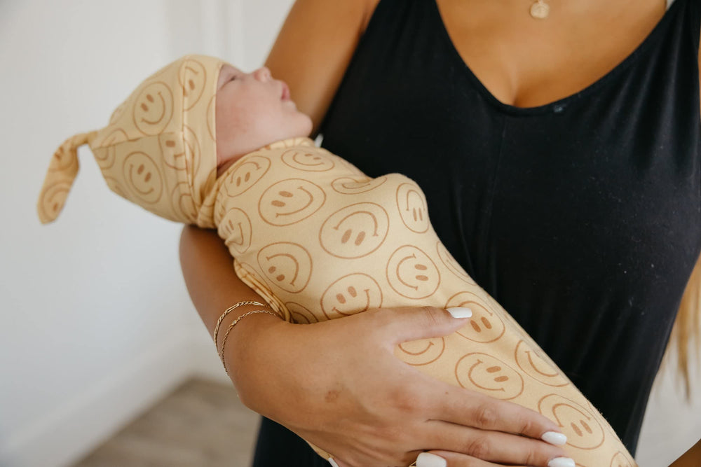 Copper Pearl swaddle blanket used as nursing cover for discreet feeds.