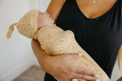 Copper Pearl swaddle blanket used as nursing cover for discreet feeds.
