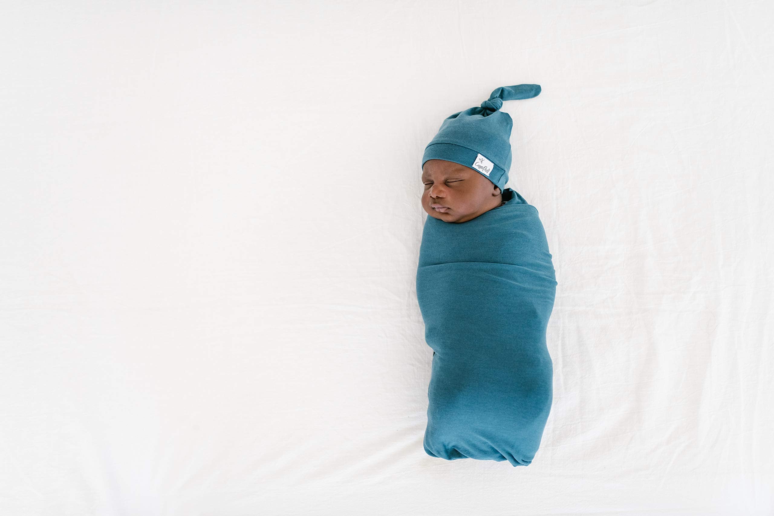 Copper Pearl steel swaddle blanket layered for toddler warmth at bedtime