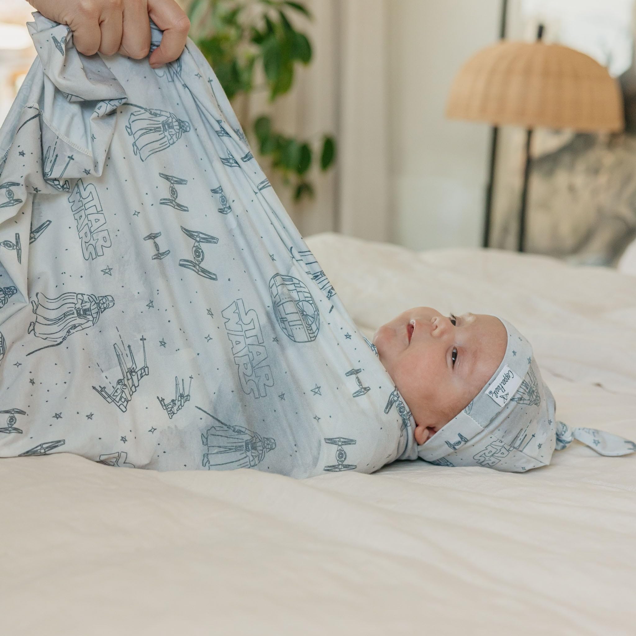 Copper Pearl Empire folded image emphasizes compact, gift-ready presentation for new moms.