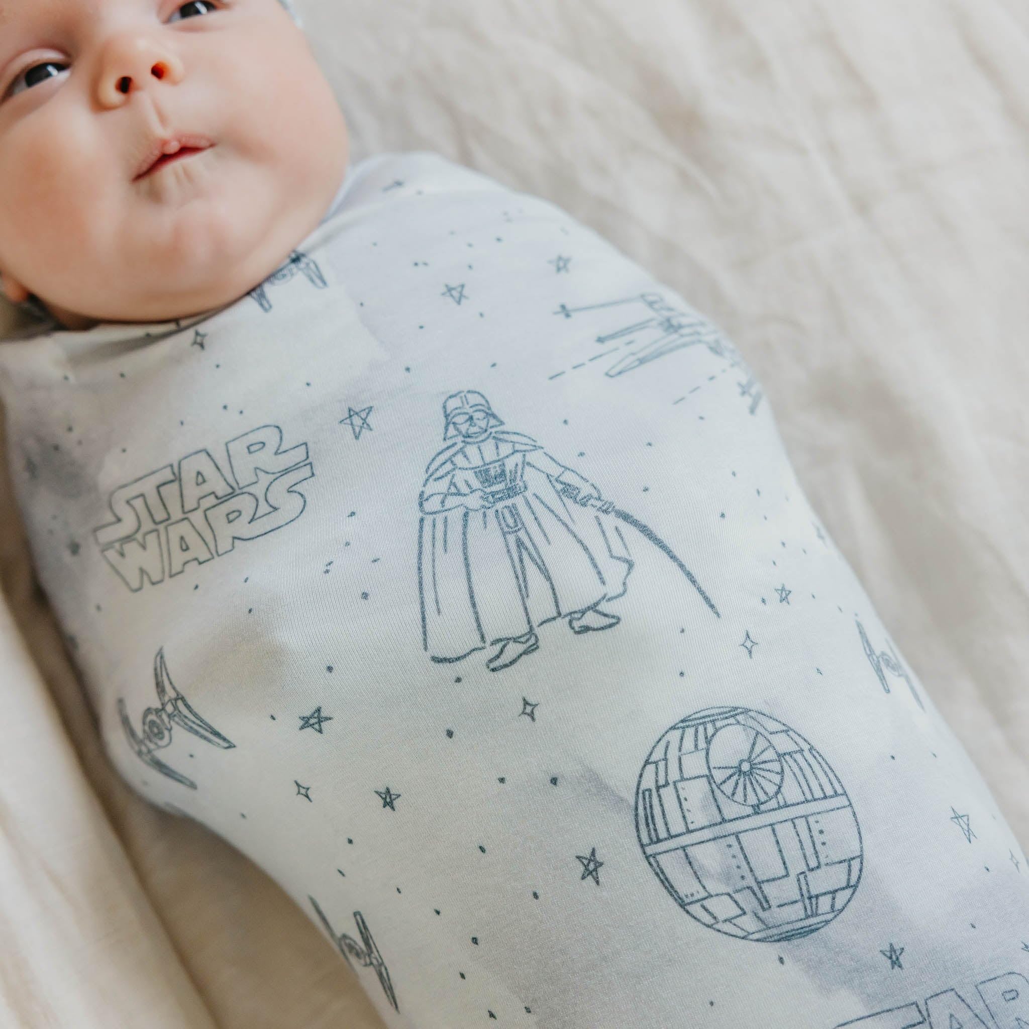 Copper Pearl Empire in-use image shows a snug baby wrapped softly during swaddling.