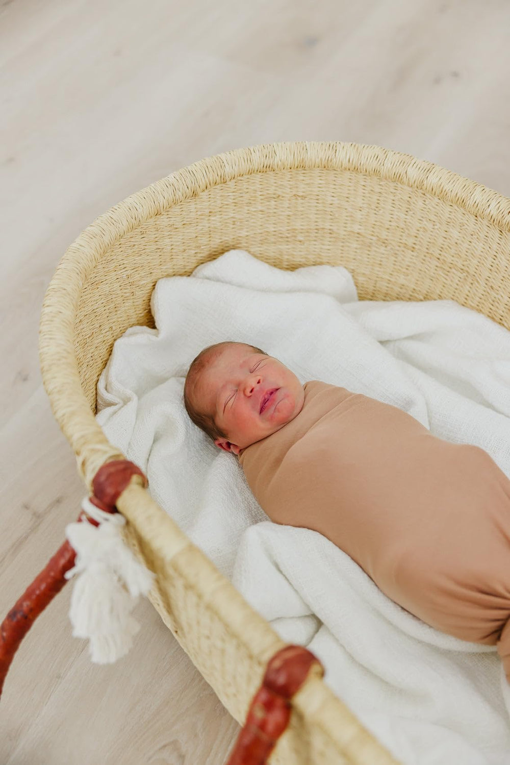 Copper Pearl swaddle blanket pecan with stroller shield usage outdoors.