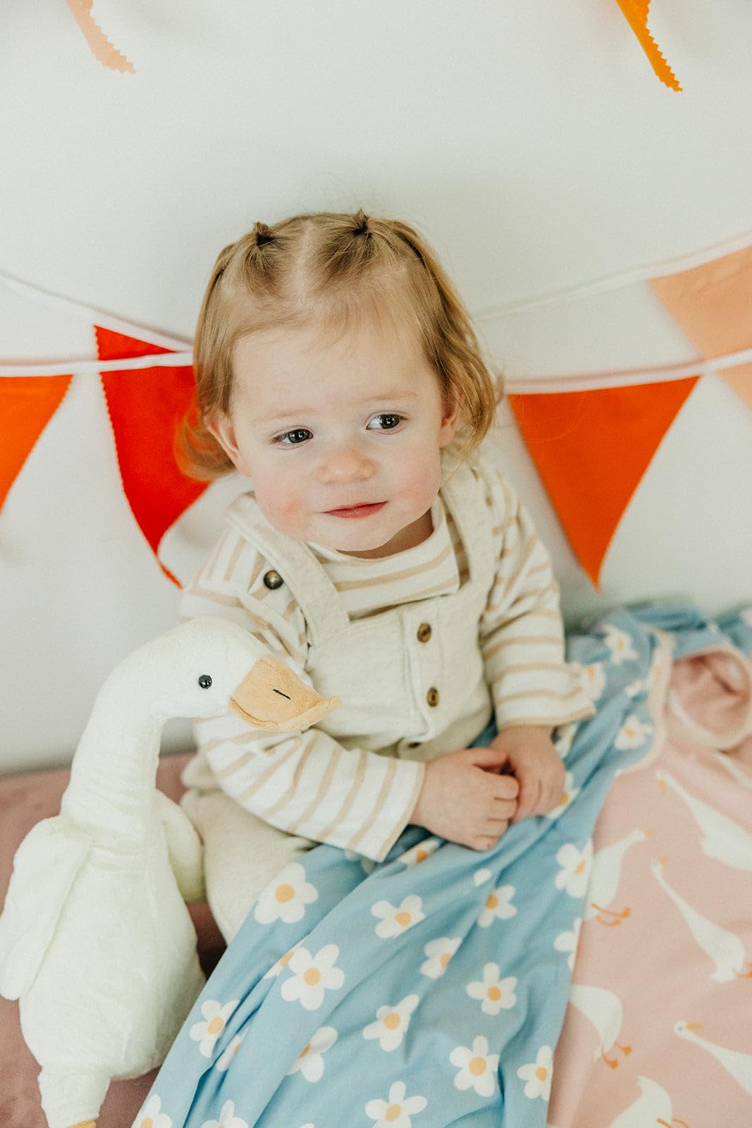 Copper Pearl blanket in-use swaddling scene highlights soft, breathable comfort.