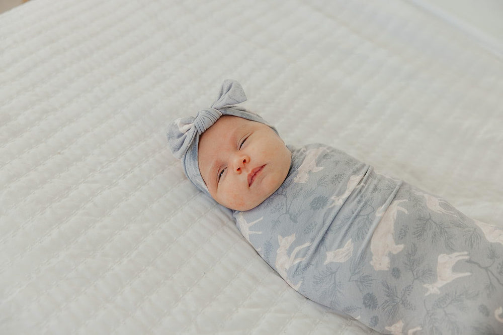 Copper Pearl Timber swaddle in stroller usage provides gentle shielding.