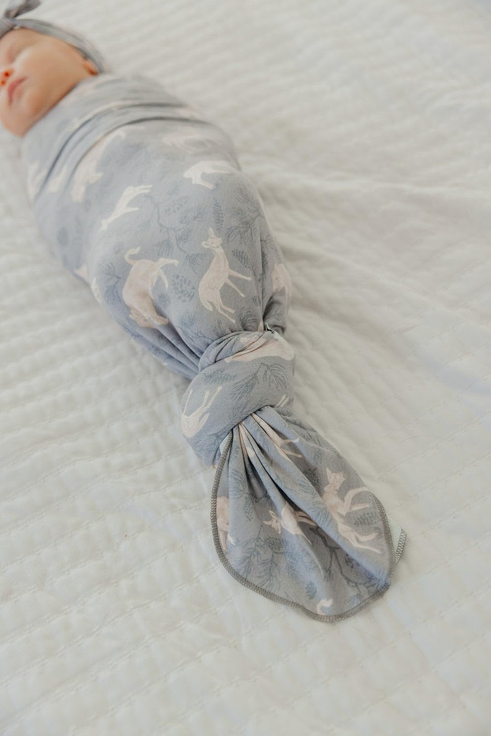Copper Pearl Timber swaddle used as nursing cover for discreet feeding.