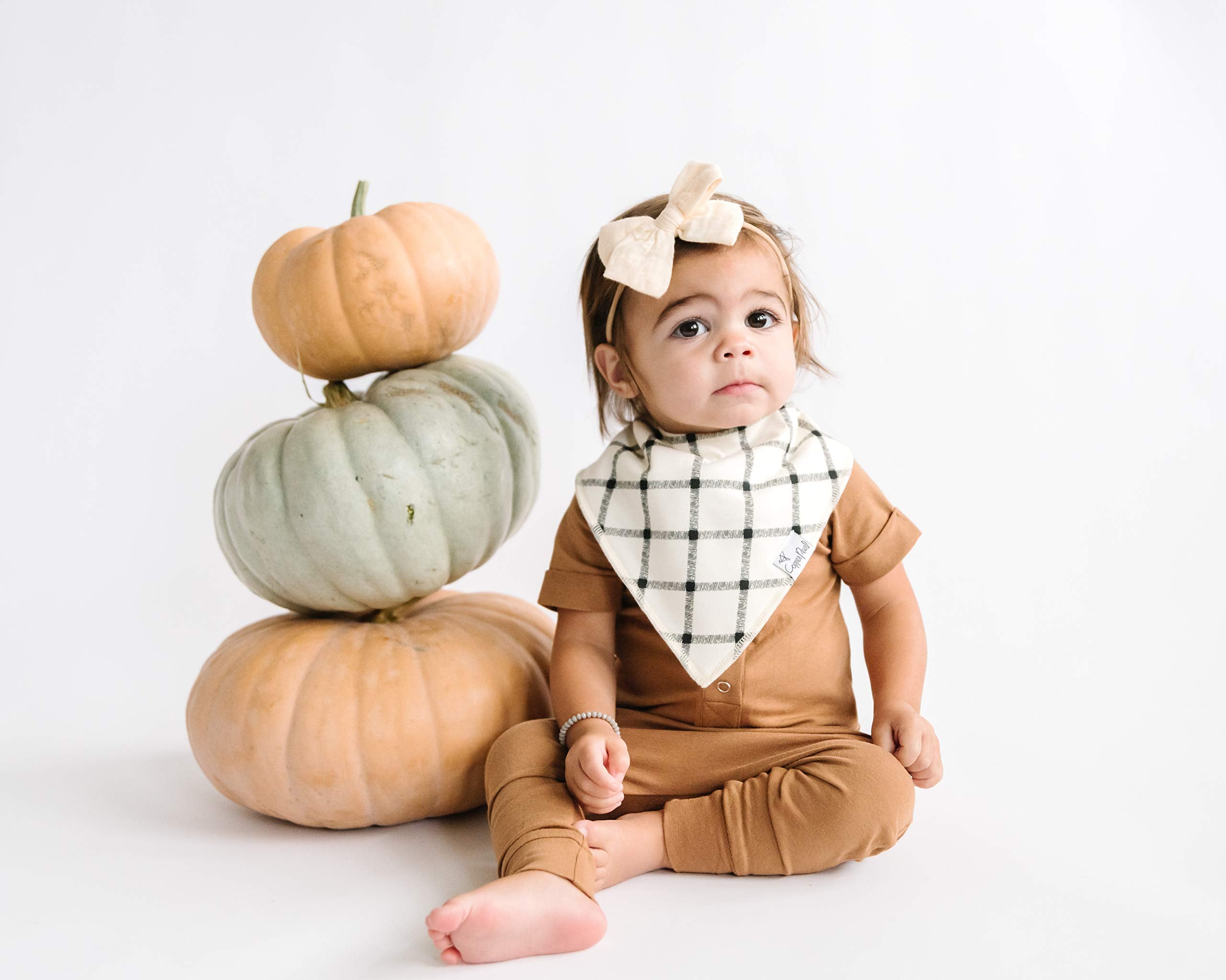 Copper Pearl bib illustrates water-resistant liner for quick cleanups and added absorbency.